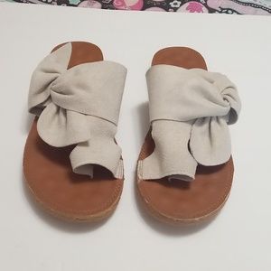 Sandles. Beige color, no size but I wear an 8.  Made in China.  Very comfortable